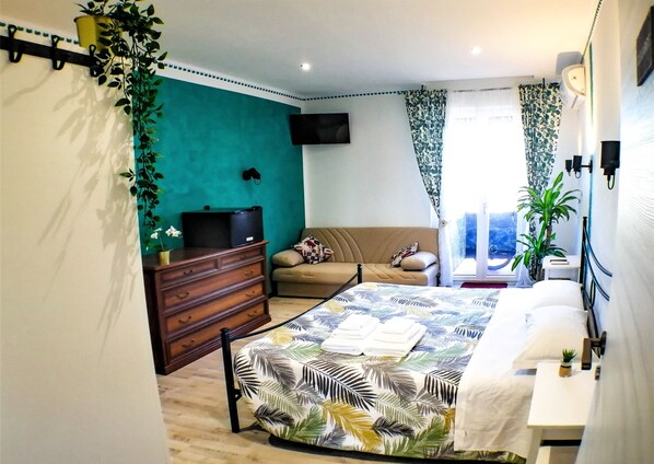 Triple Room, 1 Queen Bed with Sofa bed, Air conditioning, City View | Blackout drapes, free WiFi, bed sheets