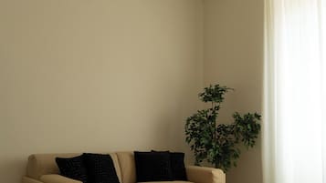 Luxury Studio Suite, Balcony, City View | In-room safe, desk, laptop workspace, iron/ironing board