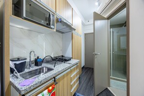 Fridge, microwave, cookware/dishes/utensils