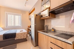 Fridge, microwave, coffee/tea maker, cookware/dishes/utensils