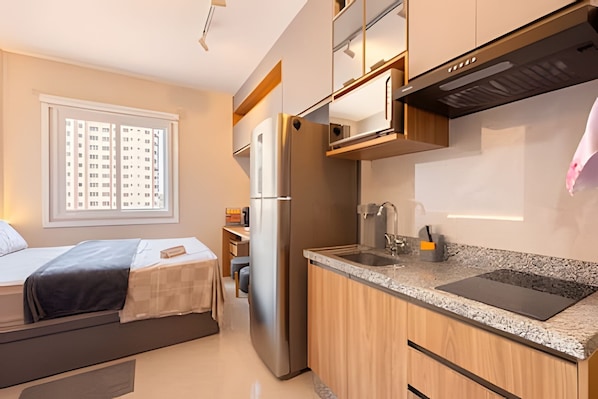 Fridge, microwave, coffee/tea maker, cookware/dishes/utensils