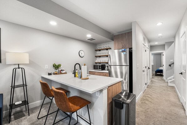 Fridge, microwave, dishwasher, coffee/tea maker