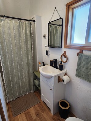Shower, towels, soap, toilet paper