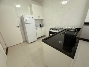 Fridge, oven, coffee/tea maker, cookware/dishes/utensils