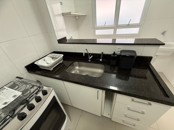 Fridge, oven, coffee/tea maker, cookware/dishes/utensils