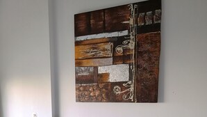 A bedroom with a bed, grey bedding, a headboard, and a wall-mounted abstract painting. - Perfect room for two INDEPENDENT (Albacete)