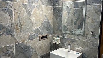 Shower, bidet, towels, soap
