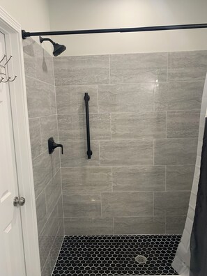 Shower, jetted tub, towels, soap