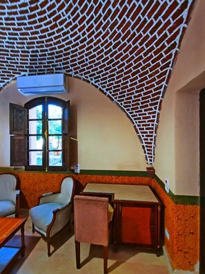 Junior Villa, 1 King Bed, Private Pool, Garden View | Living area | Fireplace - Eljuneina Villas (Luxor)