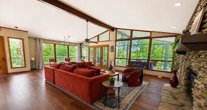 Hideaway on the lake; large mid-century stone ranch in a park-like setting