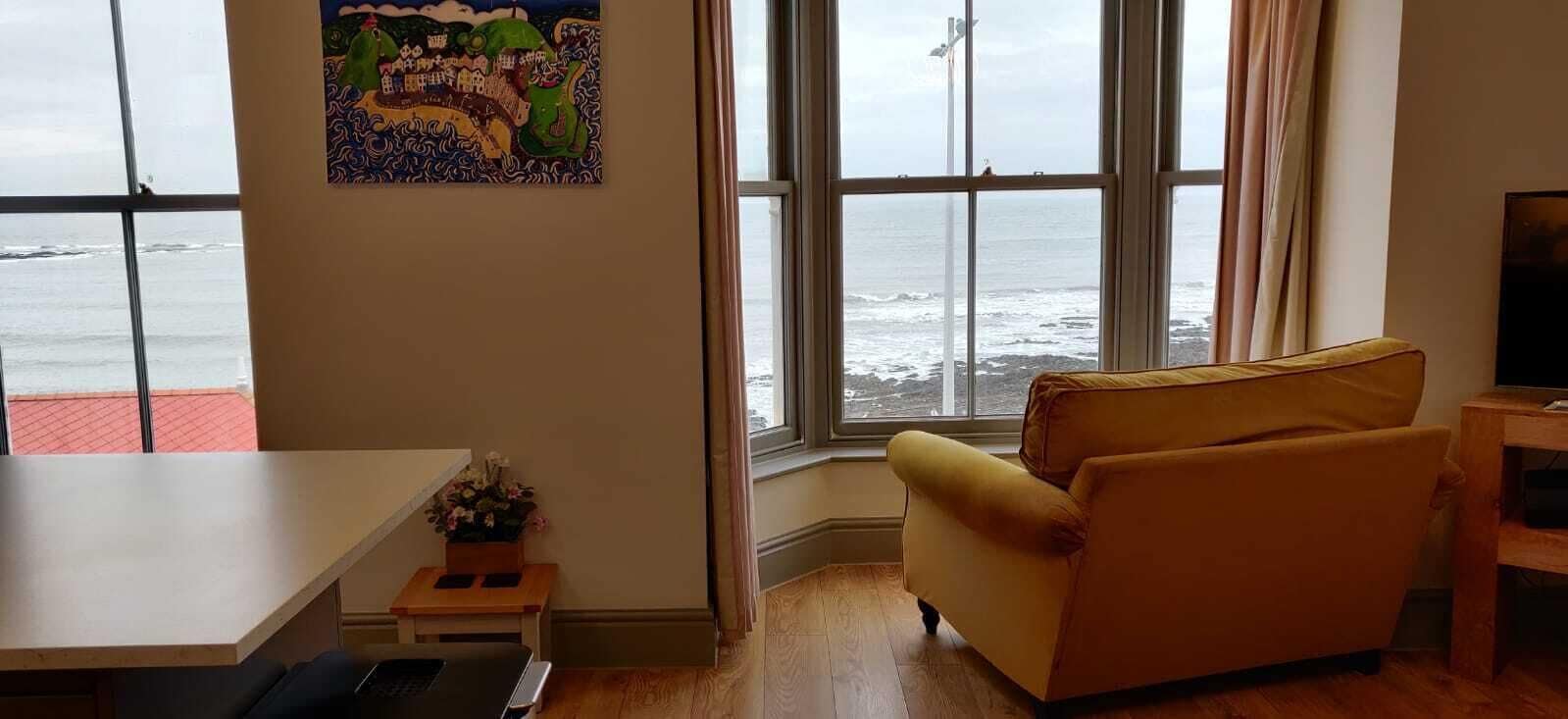 Superior Apartment, Sea View | Living area | 38-inch Smart TV with digital channels