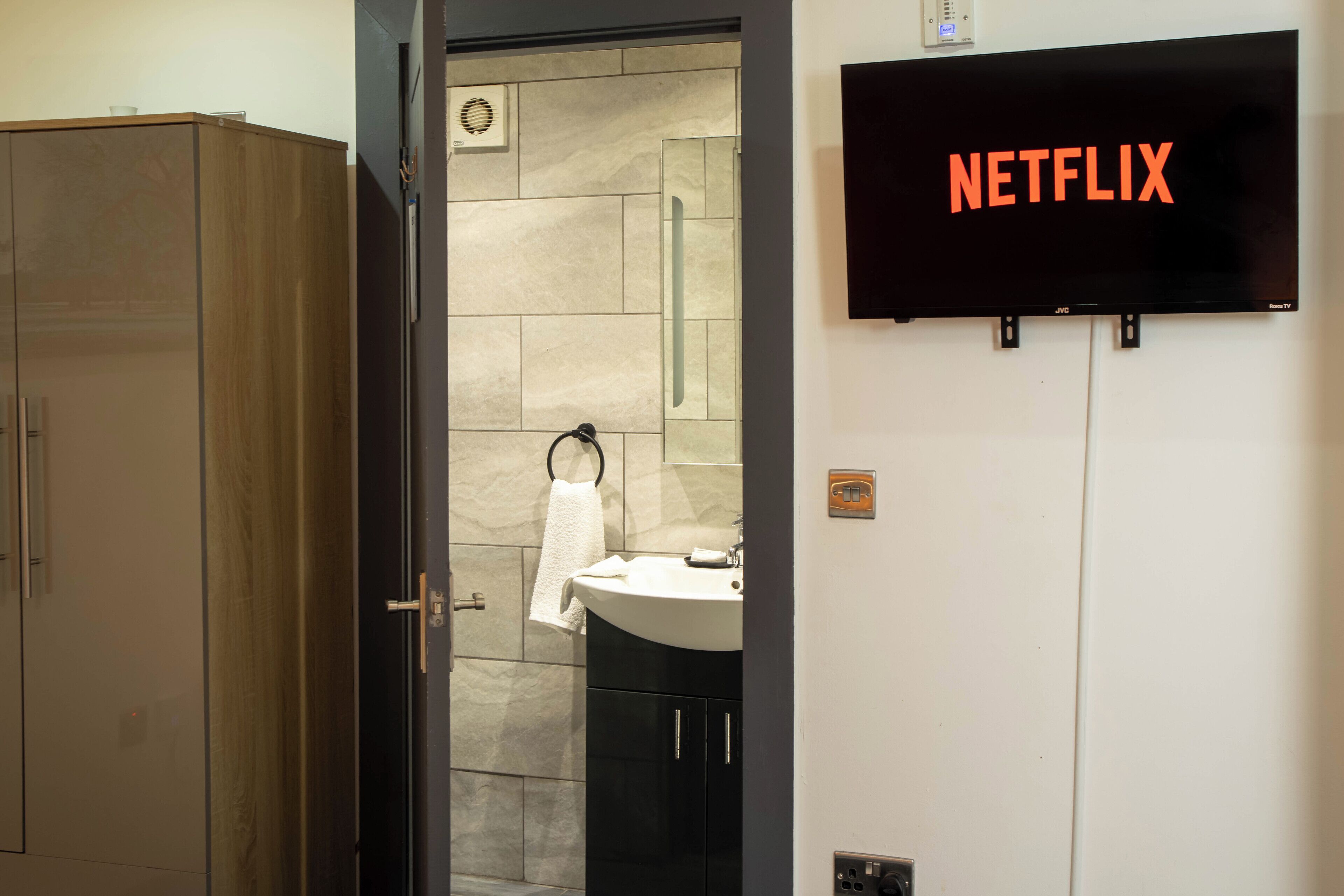 Shower, hair dryer, towels, soap