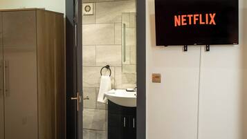 Shower, hair dryer, towels, soap