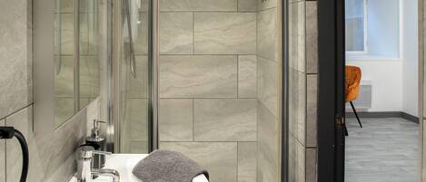 Shower, hair dryer, towels, soap