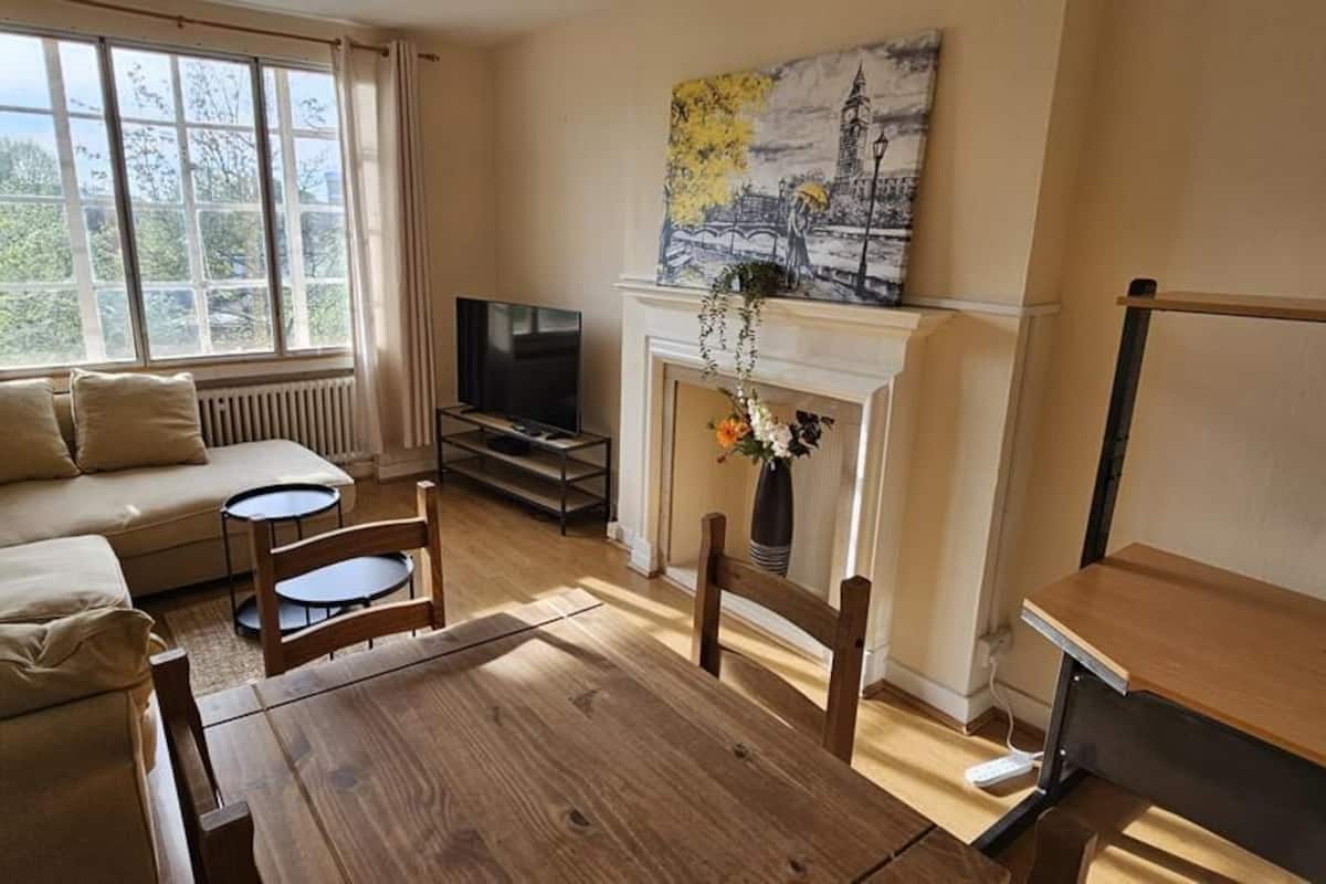 Exclusive Suite, 1 Bedroom, Kitchen, City View | Living area | 50-inch flat-screen TV with cable channels