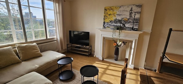 Exclusive Suite, 1 Bedroom, Kitchen, City View | Living area | 50-inch flat-screen TV with cable channels
