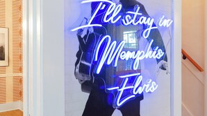A neon sign with a person and the text "I'll stay in Memphis, Elvis." - Hot Tub & Game Room~ Private Cooper-Young Bungalow -Fire Pit - Large Yard (Memphis)