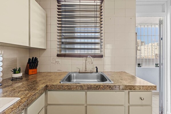 Fridge, microwave, stovetop, coffee/tea maker