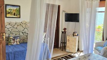 Deluxe Quadruple Room, Balcony, Hill View | Minibar, iron/ironing board, free WiFi, bed sheets