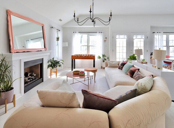 Smart TV, fireplace, table football, books