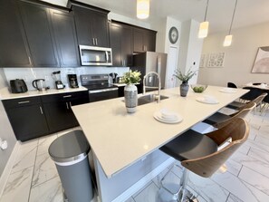 Fridge, microwave, oven, stovetop - Make yourself at home in this charming family getaway with a private pool. (Kissimmee)