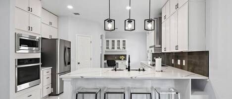 Coffee/tea maker, fridge, microwave, oven