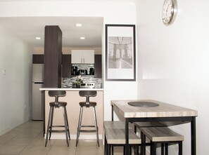 Dining - Kingston's Soul—Chic 2BR Condo w/Pool & GYM (Kingston)