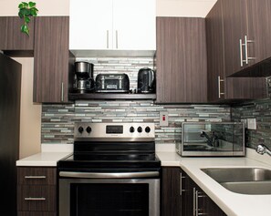 Microwave, oven, stovetop - Kingston's Soul—Chic 2BR Condo w/Pool & GYM (Kingston)