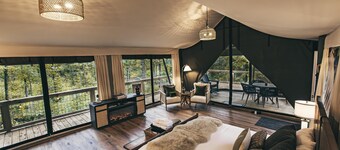 The Perch - Glamping tent with 1 King bed for 2 adults. En suite bathroom, Screened in porch.