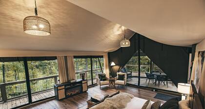 The Perch - Glamping tent with 1 King bed for 2 adults. En suite bathroom, Screened in porch.