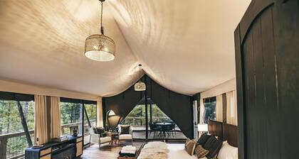 The Perch - Glamping tent with 1 King bed for 2 adults. En suite bathroom, Screened in porch.