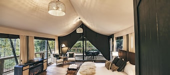 The Perch - Glamping tent with 1 King bed for 2 adults. En suite bathroom, Screened in porch.