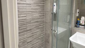 Shower, hair dryer, towels, soap