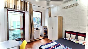 Desk, laptop workspace, blackout curtains, iron/ironing board