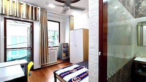 Premium Room, 1 Double Bed, Refrigerator, City View | Bathroom | Shower, hair dryer, slippers, towels