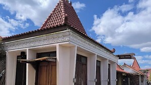 A traditional building with a tiled roof and a covered entrance. - Benada Piyungan Yogyakarta by ABM (Berbah)