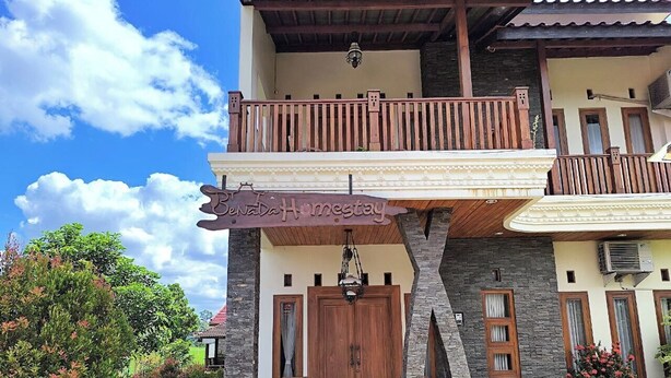 A two-story building with a balcony, a sign reading "Senada Homestay", and a stone facade. - Benada Piyungan Yogyakarta by ABM (Berbah)