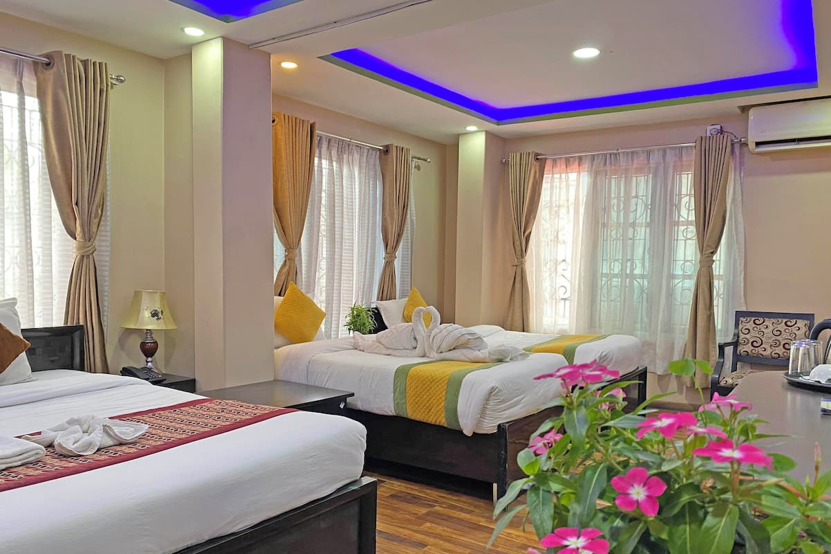 Deluxe Quadruple Room, City View | Desk, laptop workspace, free WiFi