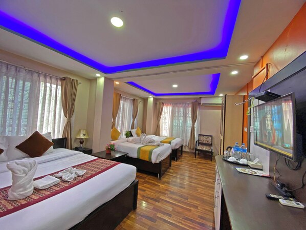 Deluxe Quadruple Room, City View | Desk, laptop workspace, free WiFi - Unique Inn (Kathmandu)