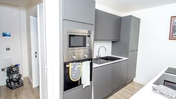 Family Apartment, Balcony, Garden View | Private kitchen | Highchair