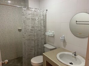 Shower, hair dryer, towels, toilet paper