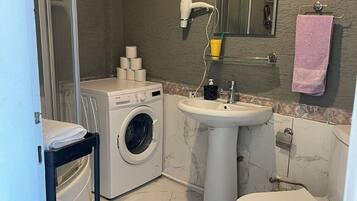 Hair dryer, towels, soap, toilet paper