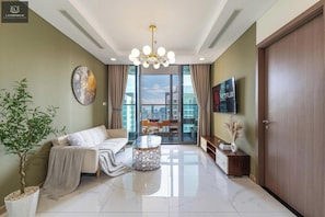 Luxury Apartment, 2 Bedrooms, Refrigerator & Microwave, City View | Living area | 24-inch TV with digital channels - Landmark 81 Residence Elegant  (Ho Chi Minh)