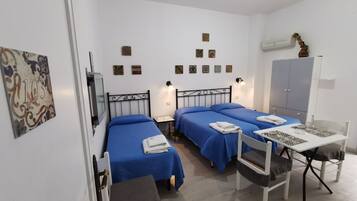 Triple Room, Patio, City View | Iron/ironing board, free WiFi