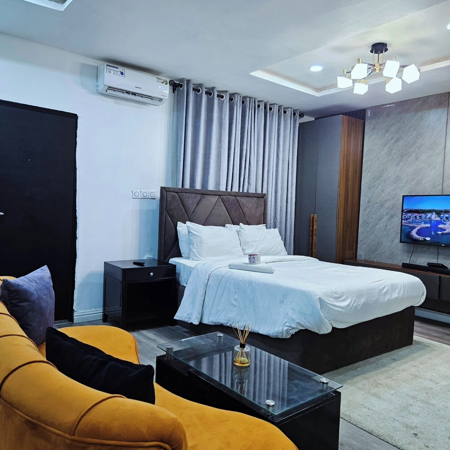 Family Apartment, Balcony, City View | In-room safe, desk, laptop workspace, blackout drapes