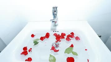 Shower, hair dryer, slippers, towels