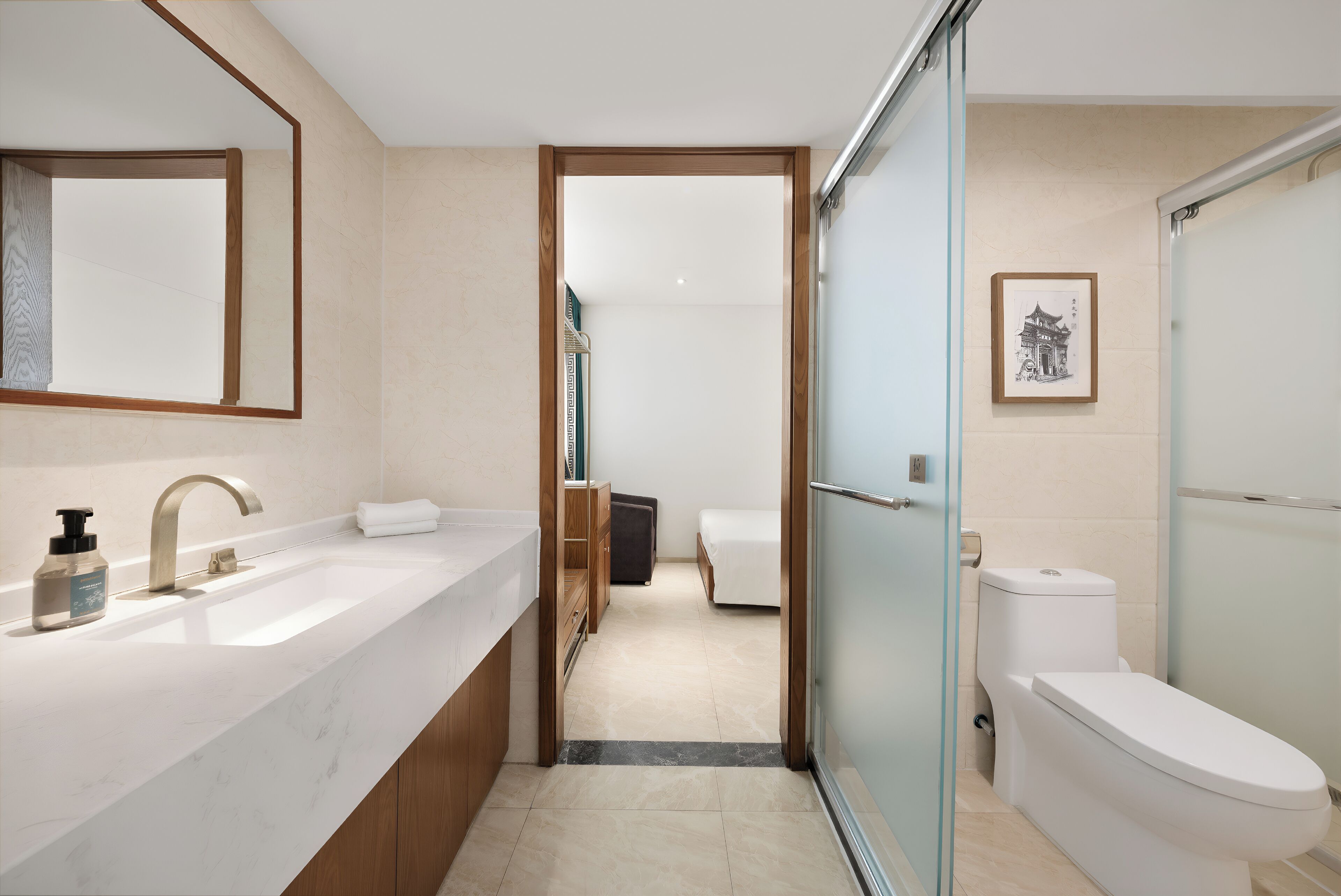 A modern bathroom with a large mirror, a sink, a toilet, and a shower area.