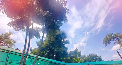 Aaira Farmstays-Garden with a pool.It has 2 cosy rooms,Art studio & nursery.