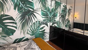 A bedroom with a bed, a large mirror, and a view of the beach. - Luxury Capitol 122m² Air-conditioned - Parking & Elevator & Subway (Toulouse)