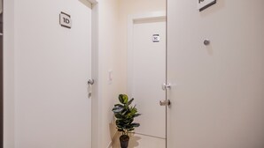 A hallway with doors labeled 'ID' and 'IC-1D'. - Modern and functional space in the heart of the city (Mazara del Vallo)